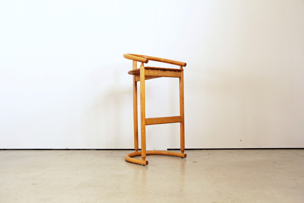 Organically shaped oak bar stools from Allmilmö